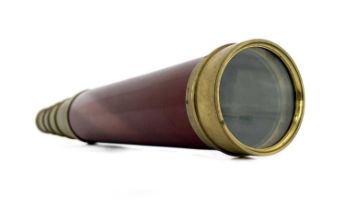 A 19th century four draw brass telescope, Dolland, London, red lacquered wood barrel with gilt brass