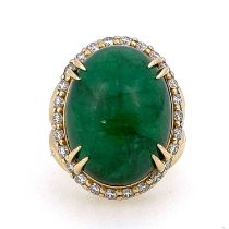A large cabochon emerald and diamond cluster ring, 14 carat gold, the central green stones within