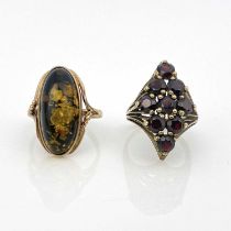 A 9ct gold garnet cluster ring and a 9ct gold amber ring, ring sizes: P/P 1/2 and M 1/2, 7.2g (2)