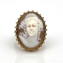 A 9ct gold ring set with an oval cameo depicting a bust portrait of a lady, ring size Q, 8.4g