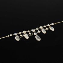 A late 19th Century gold moonstone fringe necklace, on a later integral curb-link chain, chain