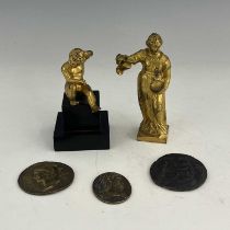 A collection of 19th century Grand Tour gilt metal plaques and figures, including Raphael Madonna