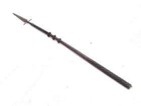 A 19th century spontoon, mounted on a Continental carved shaft, the steel leaf blade with cross