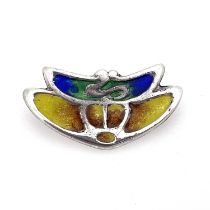 Archibald Knox for Liberty and Co., an Arts and Crafts silver and enamelled brooch, William Hair