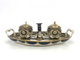 A Coalport inkstand, circa 1830, oval ogee twin handled form, the two fixed lidded inkwells with