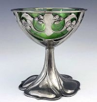 Archibald Knox for Liberty and Co., a Tudric Arts and Crafts pewter and green glass pedestal bowl,