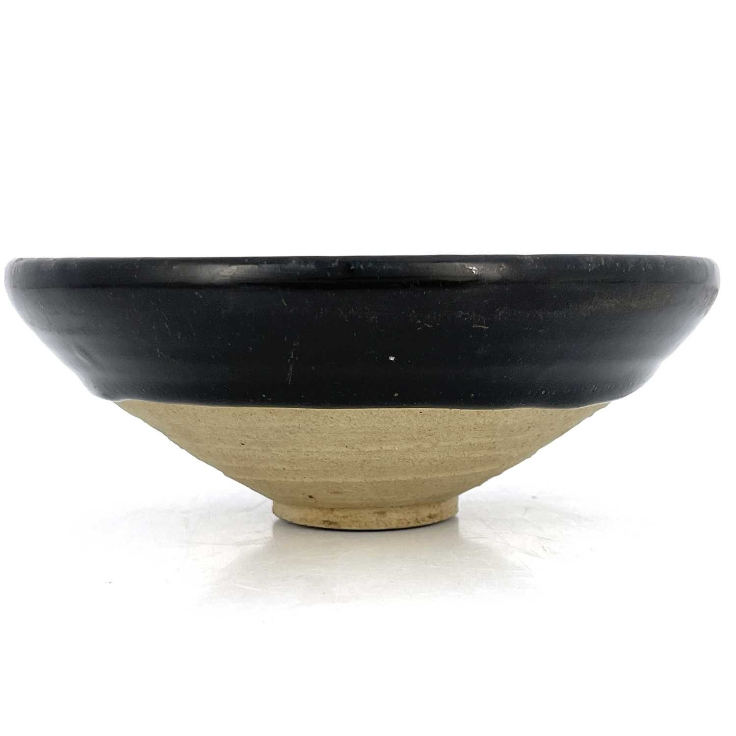 A Chinese Jian type black glazed bowl, probably Southern Song dynasty, conical with dipped glaze, - Image 3 of 4