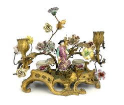 A German porcelain and ormolu mounted florally encrusted figural desk stand, in the Meissen style,
