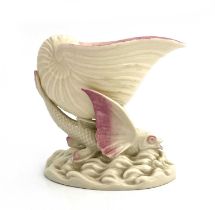 A Belleek second period flying fish pedestal bowl, modelled as a shell supported by a winged fish on