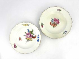 A matched pair of Meissen style floral painted plates, ogee moulded borders, decorated with floral