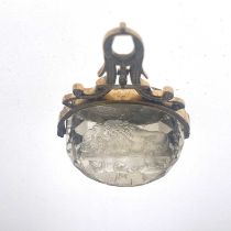 A mid-19th Century gold mounted triple facet cut quartz intaglio swivel fob seal, 4cm high