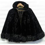 A 19th century French black evening cape, beadwork, silk ruffles, Parisian maker label