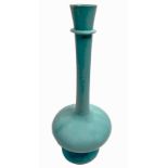An unusual Islamic, turquoise glazed monochrome bottle vase, possibly Persian, H.43cm