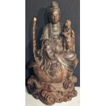 A Chinese wooden carving of Guanyin, H.38cm