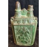 A rare 18-19th century Ottoman Greek green glazed oil container depicting St.George slaying the