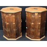 A pair of campaign style octagonal occasional tables with hinged lid tops, brass bound, twin