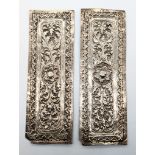 A pair of 19th century Malay silver pillow ends, L.16cm