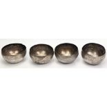 A set of four Malay silver bowls, circa 1900, band of etched decor, total weight 300g, D.10.5cm