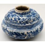 A 17th century Persian Safavid blue and white glazed pottery squat vase, H.9cm D.16cm