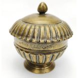 A 17th century Mughal Indian bronze round pandan box, H.13cm D.12cm