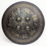 A very fine 19th century North Indian gold inlaid steel shield with chiselled figural decoration,