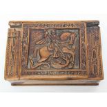 An 18-19th century Greek carved wooden box depicting St George and the Dragon, L.9cm