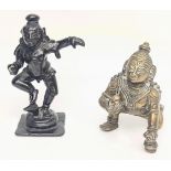 An 18th century Indian bronze figure of Krishna together with another bronze god, H.9.5cm