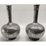 A fine near pair of early 19th century Indian Bidri silver inlaid bottles, H.24cm