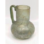 A 13th-14th century Timurid Persian or central Asian glass jug, H.12.5cm