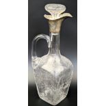 An Edwardian silver and glass wine carafe by William Comyns, the rectangular glass body with