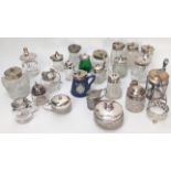 A collection of silver and silver plated and glass mustard pots and condiment pots, including an