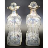 A pair of of Victorian silver and glass glug decanters, hallmarked London, 1890/91, H.23.5cm