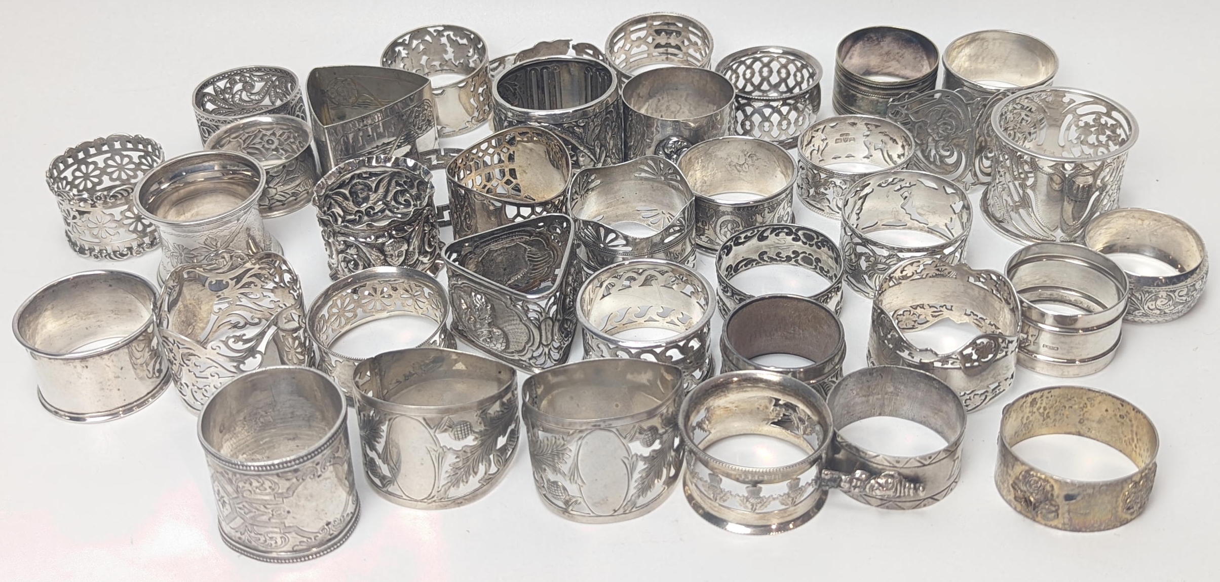 A large collection of silver napkin rings, various hallmarks, 800g,