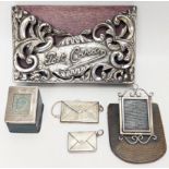 A collection of Edwardian silver postcard and stamp holders, all British hallmarks (5)