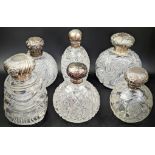 A collection of 6 Edwardian silver and glass scent bottles. Condition report: Overall good, no