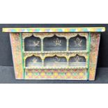 A Moroccan wall hanging spice rack shelf, L.72cm