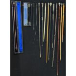 A collection of walking canes and swagger sticks, multiple silver examples, a bone example and