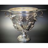 A Victorian silver Skyphos cup, repousse body with chased berries and ivy against a pounced