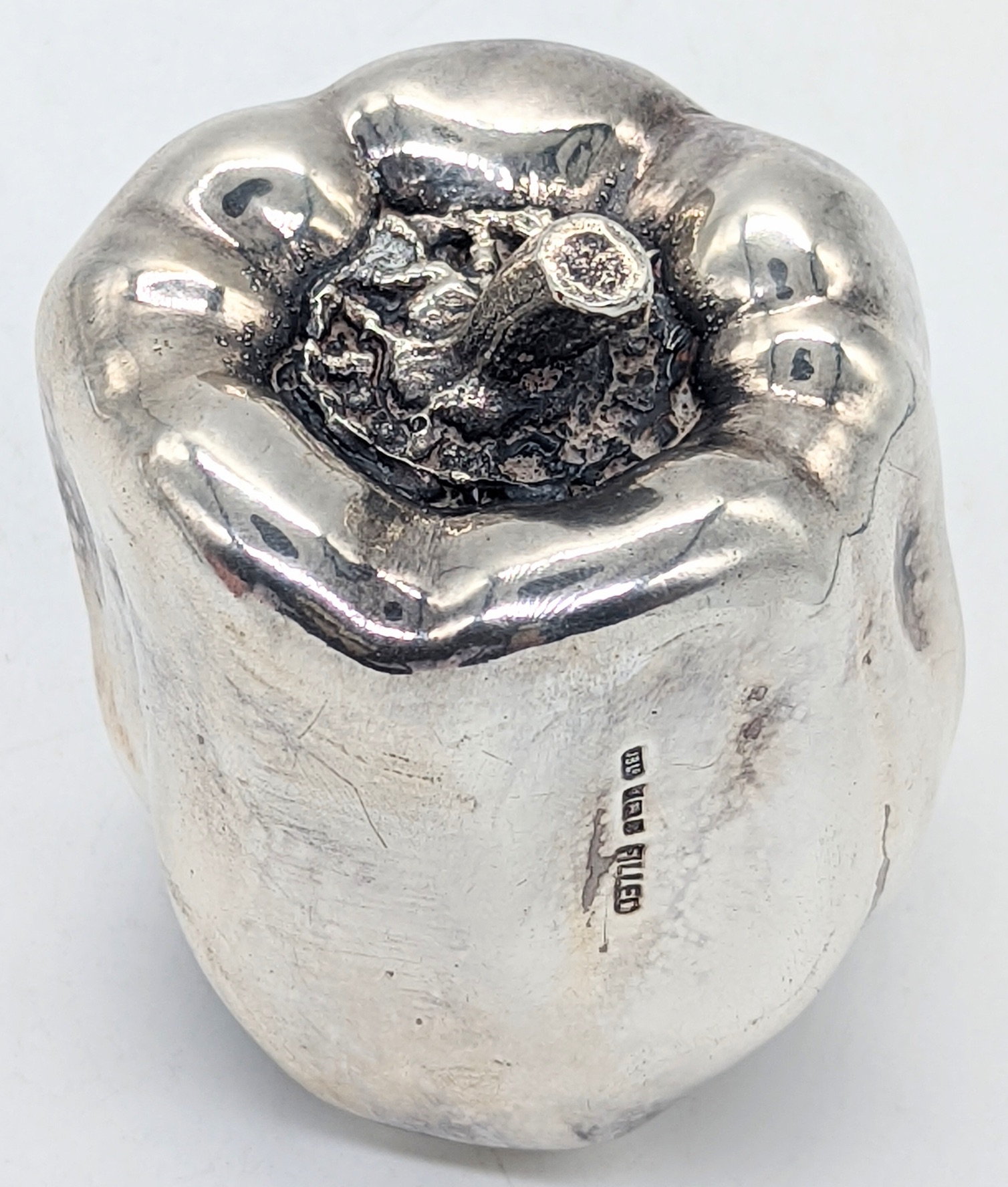 An unusual silver coated red pepper, hallmarked Birmingham, 1996, filled, 225g, H.7.5cm