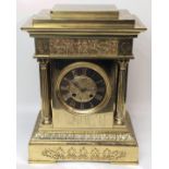 An early 20th century French brass mantel clock, Grecian style frieze, Corinthian column supports,