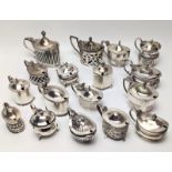 A collection of Edwardian silver mustard pots, British hallmarks, most with glass liners, total