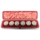 A set of 6 Art Nouveau silver buttons depicting a maiden playing a harp, within original red box,