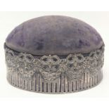 A large Edwardian silver pin cushion with internal ring box, hinged top with purple upholstery,
