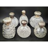 A collection of 6 Edwardian silver and glass scent bottles. Condition report: Overall good, no