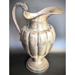 A large Mexican silver ewer, S shaped handle in the form of a serpent head, marked to base