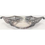 A late Victorian silver dish, pierced sides with scrolling twin handles, hallmarked London, 1896,