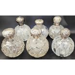 Collection of 6 Edwardian silver and cut glass scent bottles, glass stoppers, all British hallmarks.