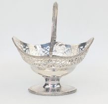 A George III silver basket by William Plummer, swing handle, pierced body with bead edges,