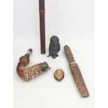 A Group of Oriental objects including a Tibetan flute, a pipe, a dagger, a Japanese miniature carved