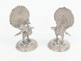 A pair of Eastern silver peacock place holder, seemingly unmarked, test as silver, 165g, H.8.5cm